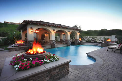 © Scott Cohen - Formal modern resort pool design with swim up bar fire and    water feature 1