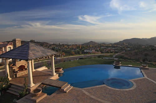 © Scott Cohen - Formal modern vanishing edge resort pool design with spa and    water feature 3